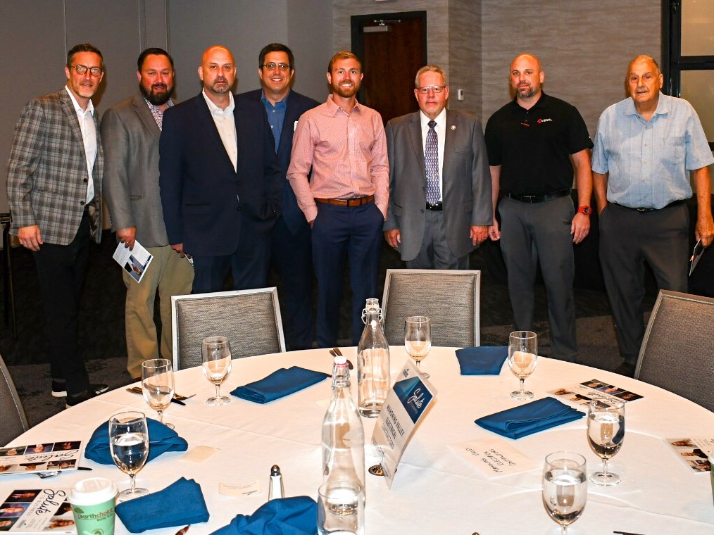 LMCC committee members stand together during the Youngstown Warren Regional Chamber meeting. 