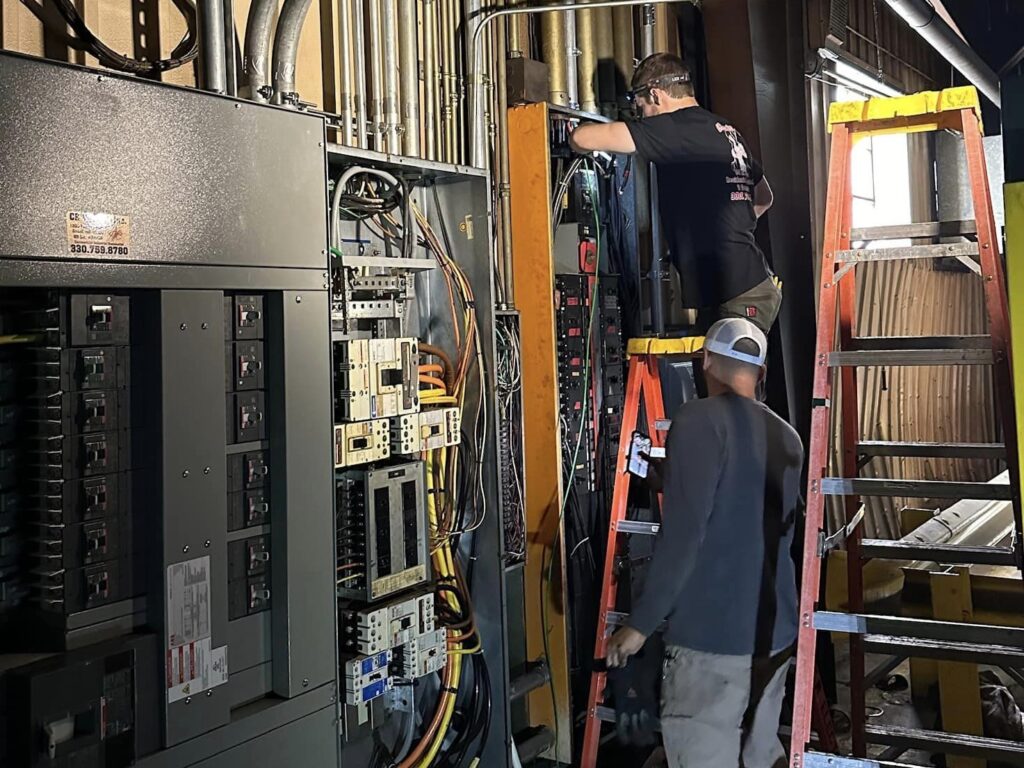 Electricians working on power upgrade at Brainard Rivet in Girard.
