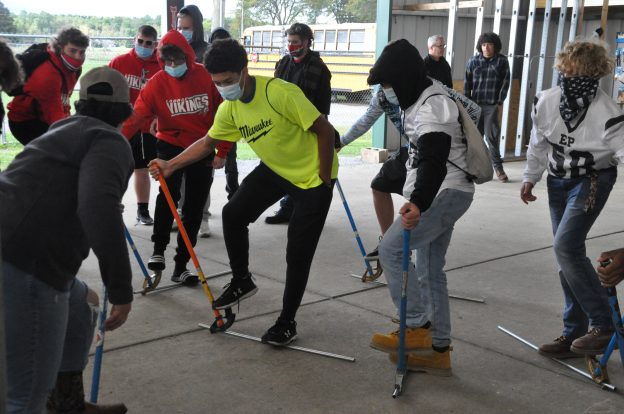 High school students learn to bend conduit.