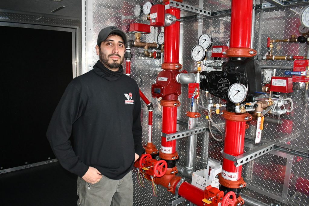 electrician standing inside trailer
