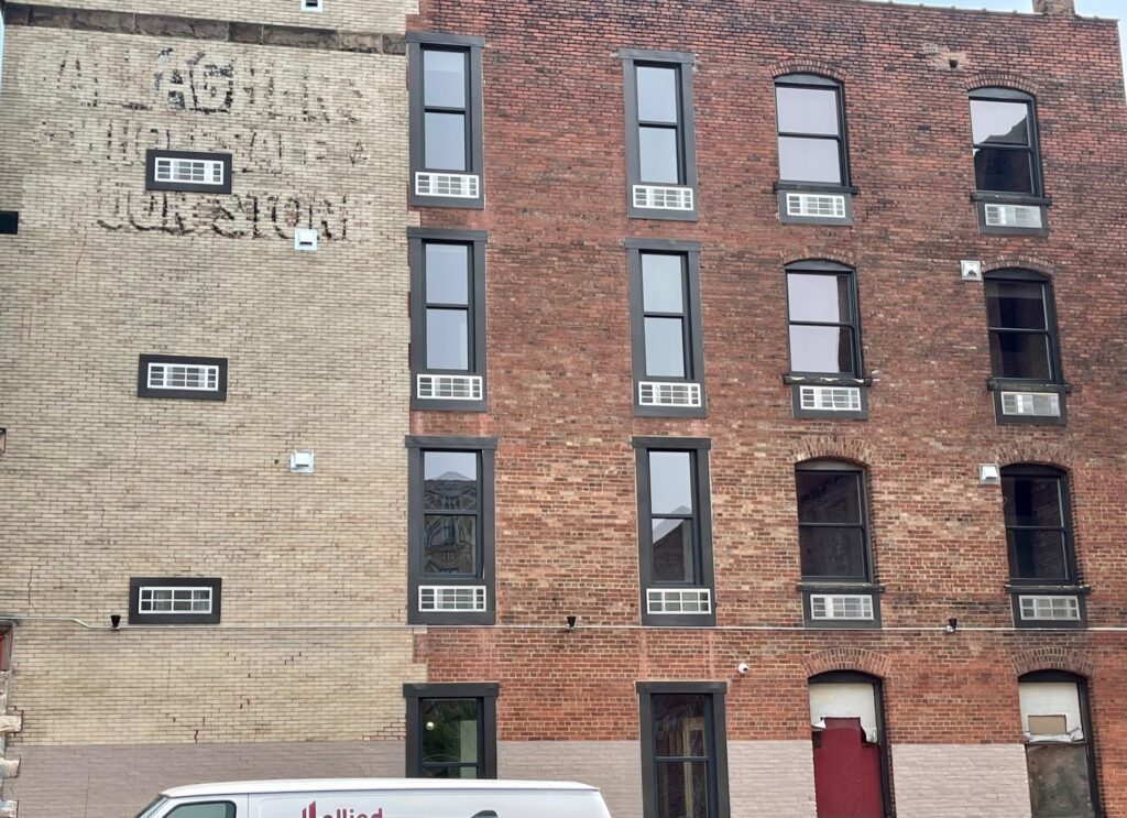Side of Gallagher Building showing windows to apartments
