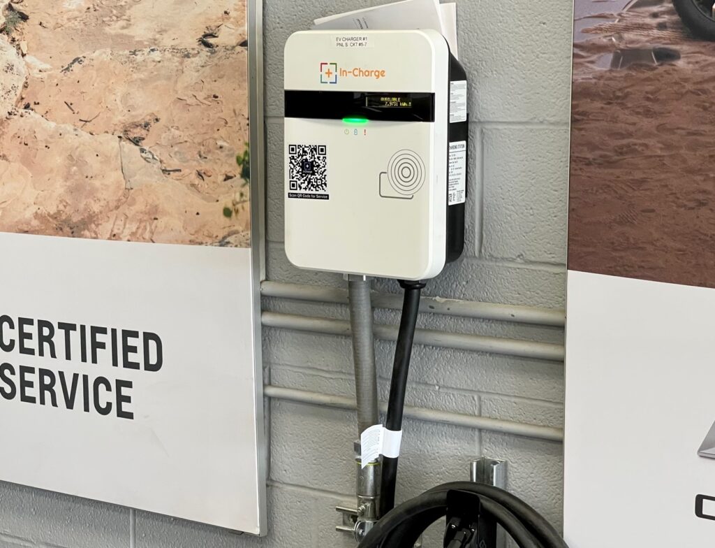 Smaller EV charger inside Greenwood Chevrolet service garage in Austintown.