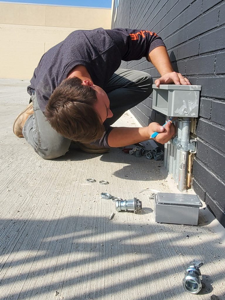 Jeremy Baltes installs electrical components.