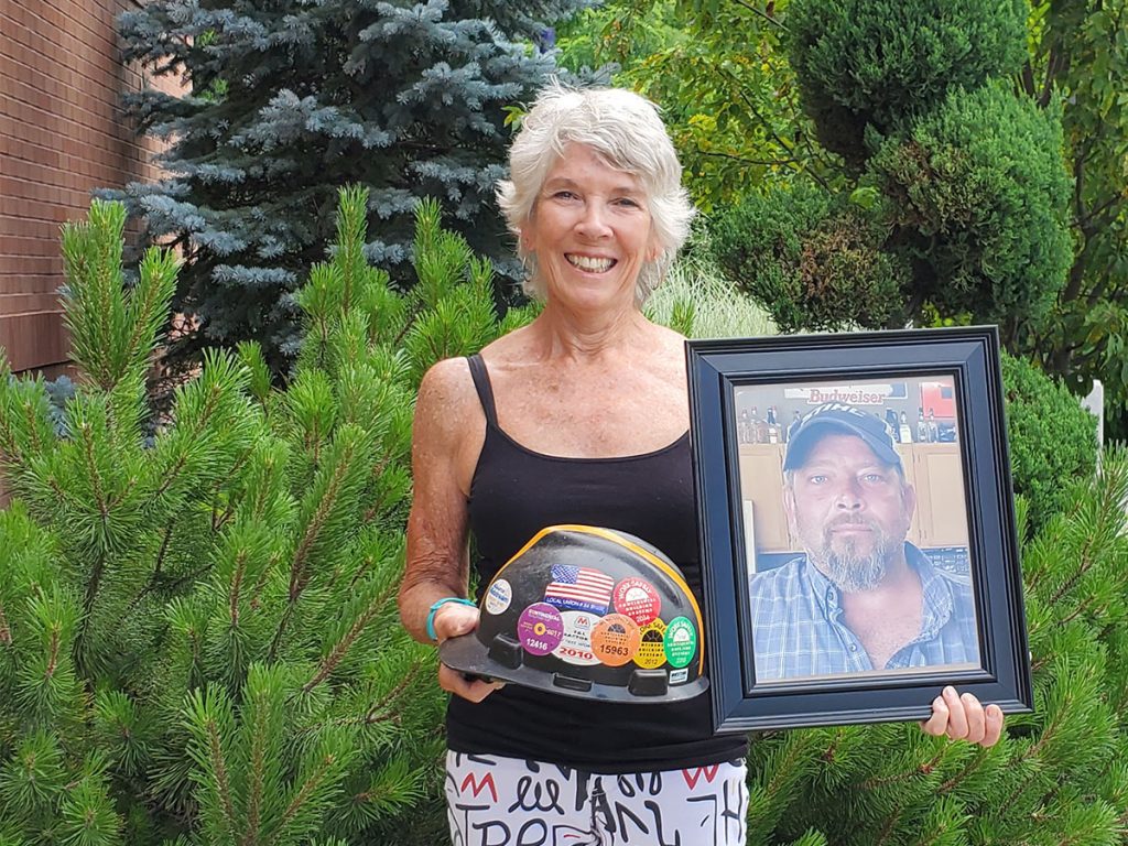 mary ann wilson holds photo of son