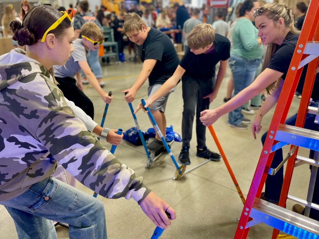 Apprentice leading a conduit bend demonstration at the Mahoning Valley Skilled Trades Expo.